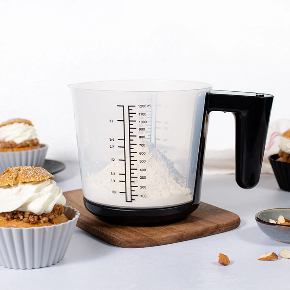 measuring cups, kitchen scales, and a gallon jug.